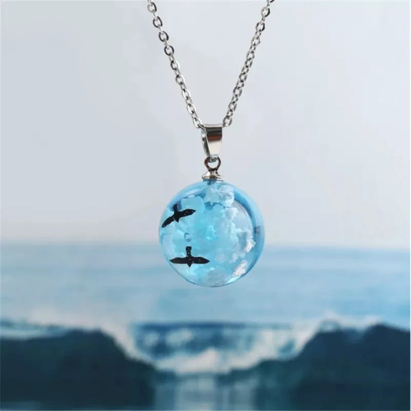 For every necklace you buy, we plant a tree! Earth Necklace, Creative handmade jewelry, blue sky white clouds, transparent spherical resin pendant